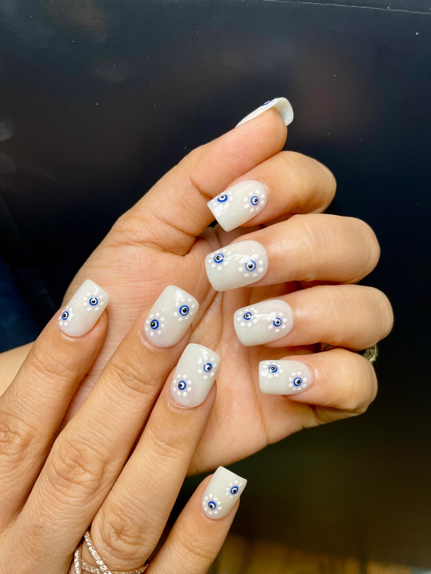 floral evil eye nails