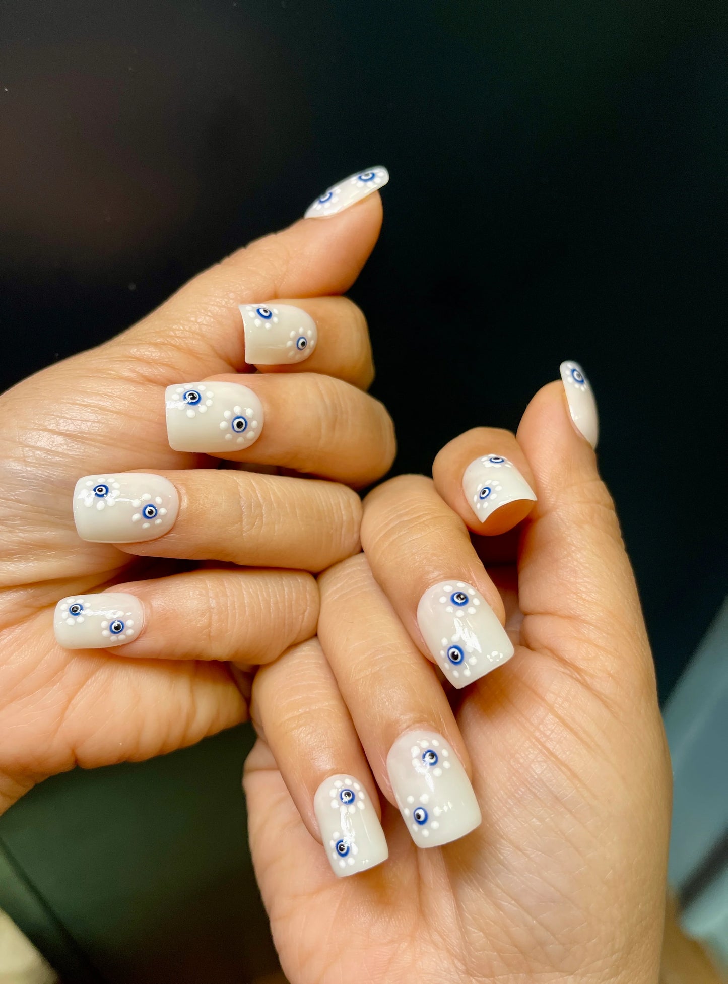 floral evil eye nails