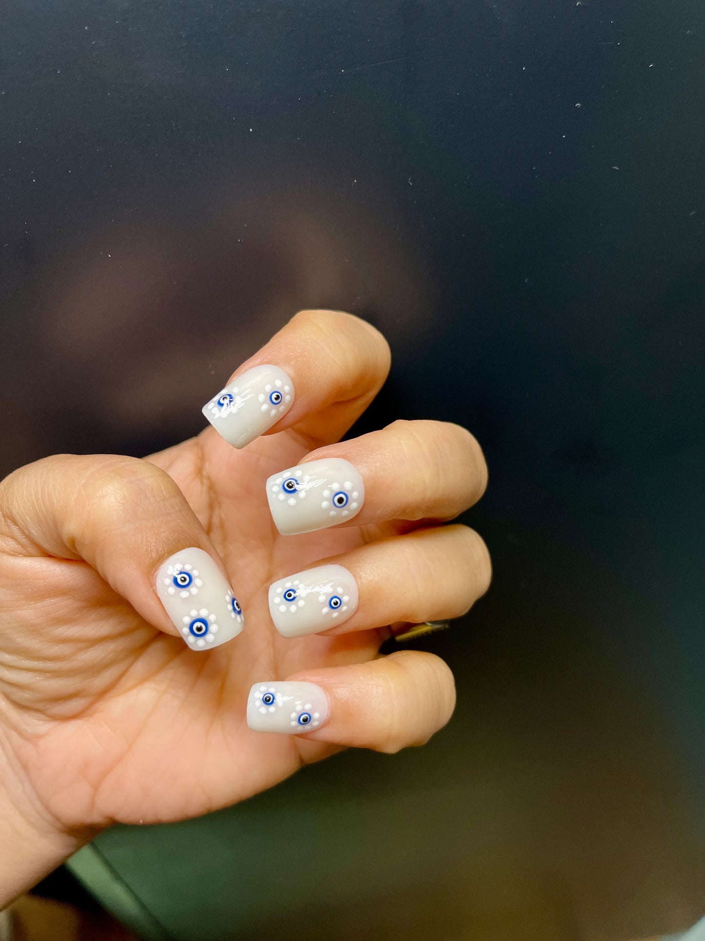 floral evil eye nails