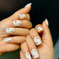 floral evil eye nails